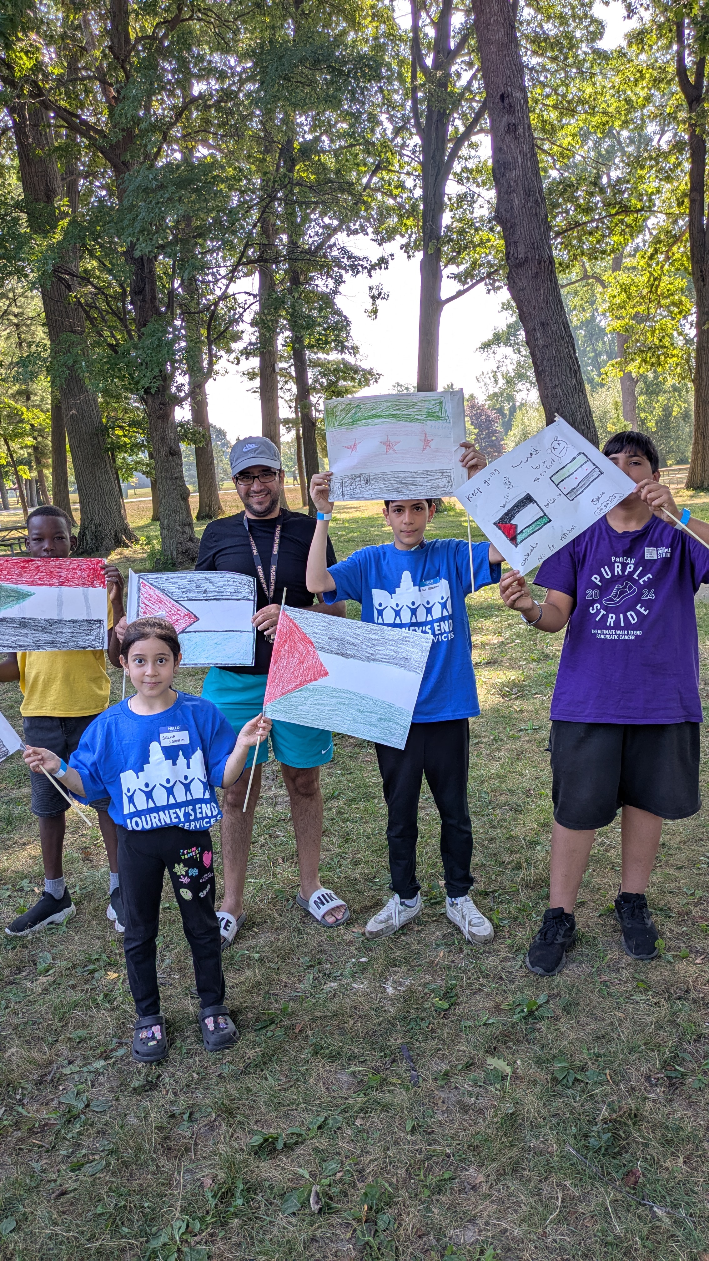 Students displaying artwork